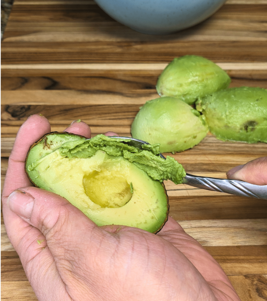 guacamole original - scooping avocados