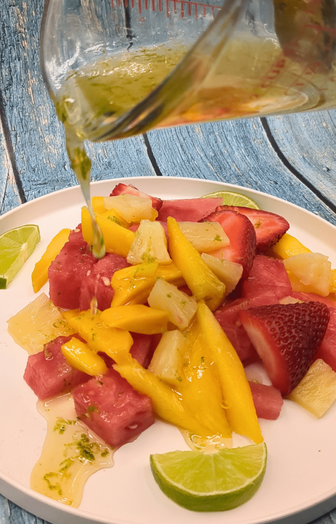 pouring dressing on salad