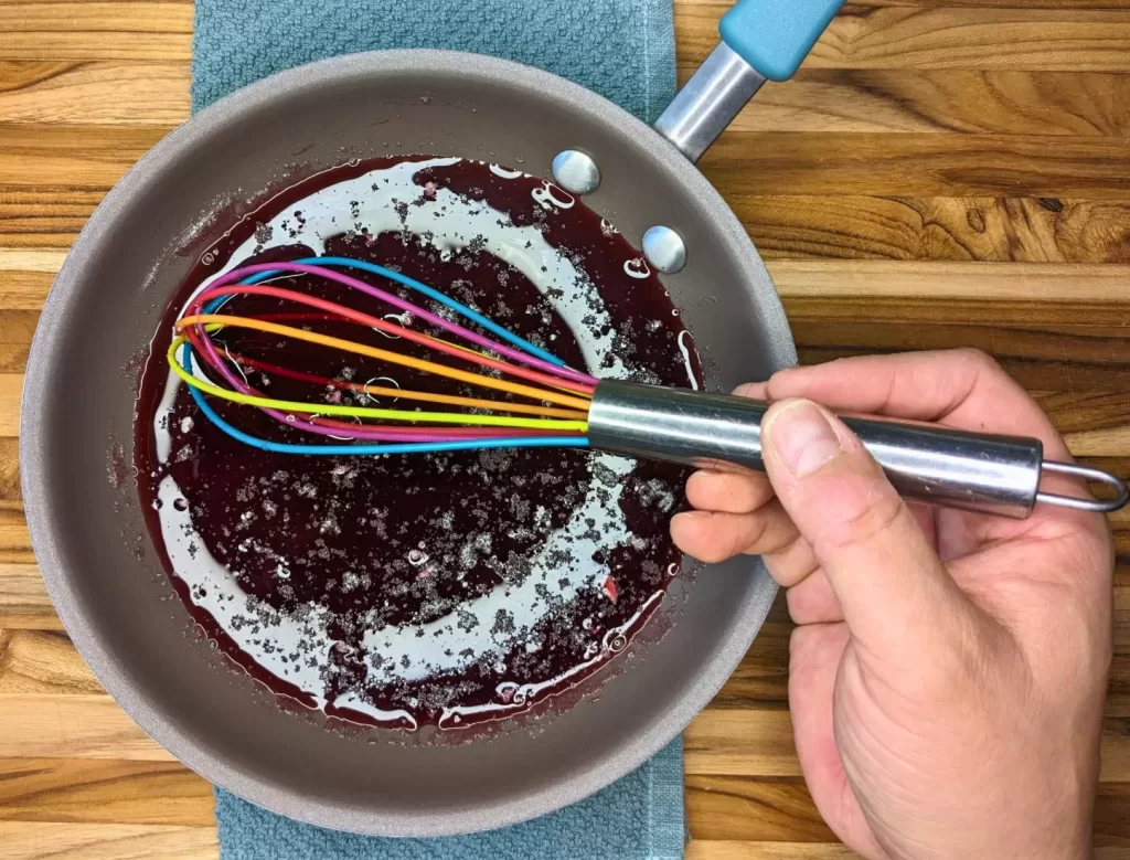 whisking hibiscus tea jelly