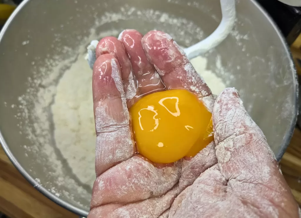 holding egg yolk