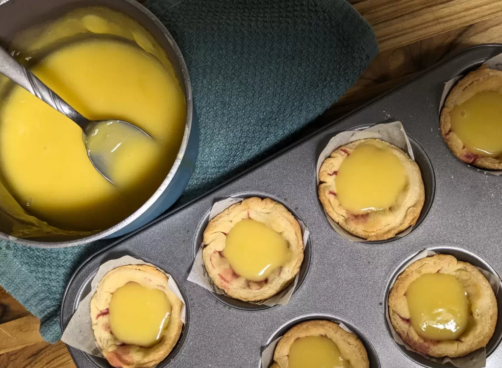 adding filling to lemon hibiscus tartlet