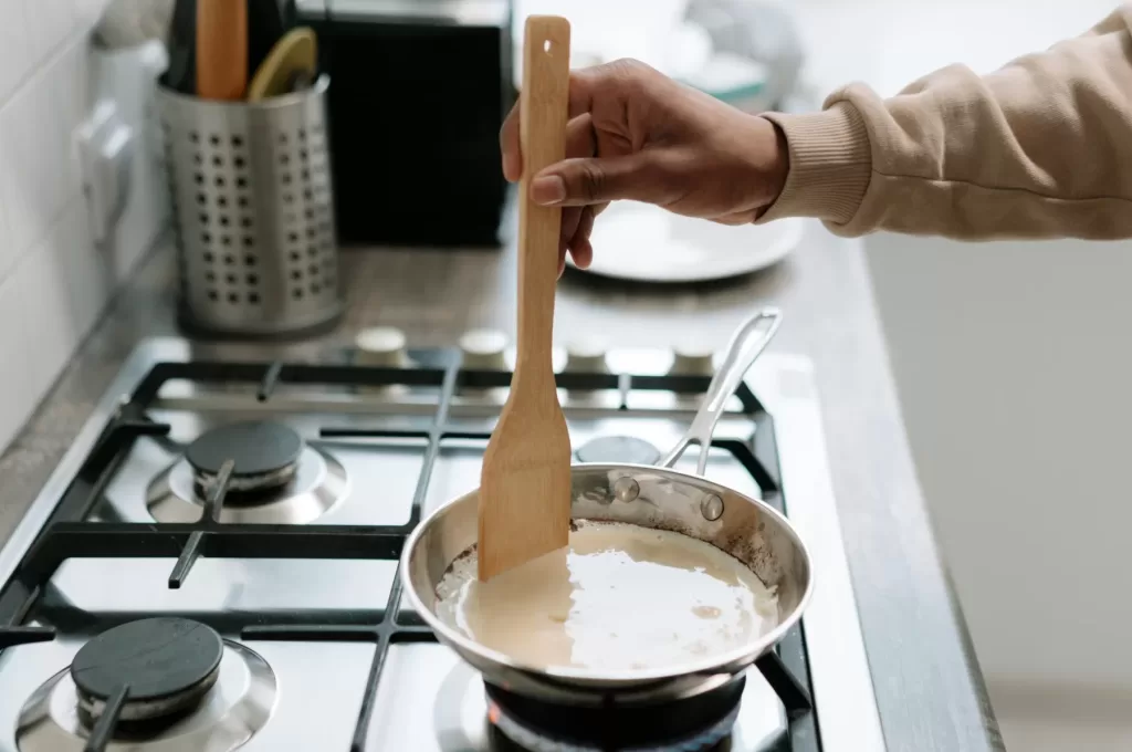 chef stirring sauce